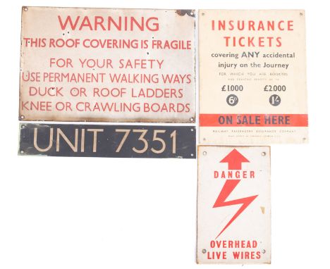 An enamel 'This Roof Is Fragile' warning sign, and electrical warning sign, a  Railway Passengers Assurance advertising sign 