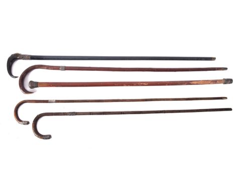 A group of five early 20th century  silver mounted walking canes, various makers and dates, including a carved horn handled e