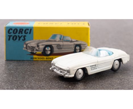 Corgi No. 303 Mercedes- Benz 300SL Open Roadster, white with light blue interior, silver trim and spun hubs, in a blue and ye