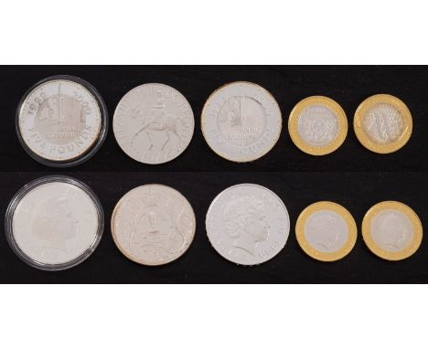 Two 2000 silver five pound coins, 2003, 2004 proof £2 coins, and 1977 silver crown.