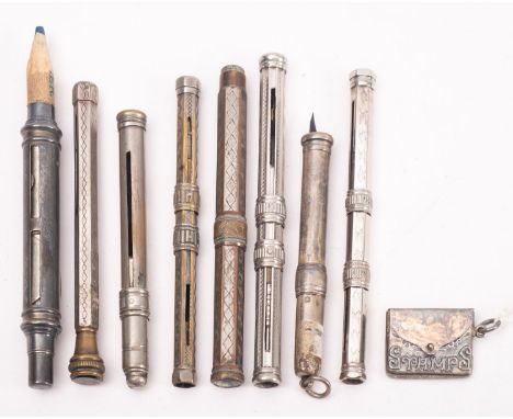 A sterling silver envelope stamp case , together with a silver stamp dispensing pencil holder and seven other various pen/pen