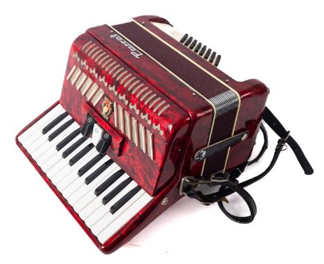 A Chinese Parrot red marbled piano accordion in case. 