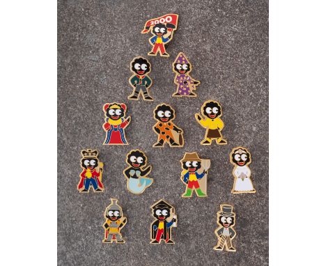 A collection of thirteen Robinson Golly badges, circa 1999,  including 'Bride' and 'Mermaid, also the 2000 Limited edition 'F