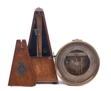 An early 20th century lacquered brass aneroid barometer, unsigned, together with a French Maelzel Paquet' metronome (2) 