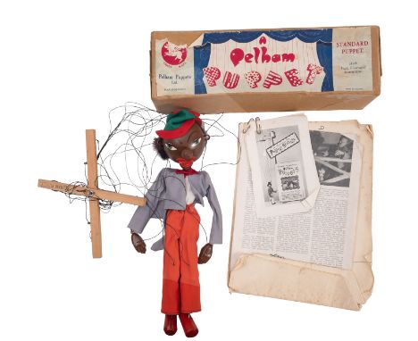A Pelham puppet, 'Minstrel', with original box and paperwork.These items are listed on the basis they are illustrative of a b