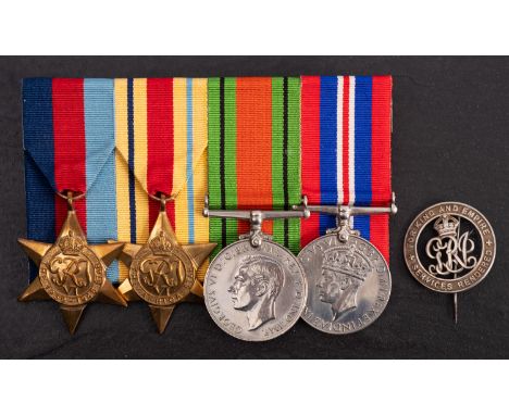 A WWI silver wound badge number 'RAF 9215' together with four WWII service medals