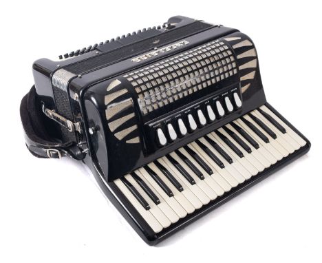 An Excelsior  Model 304 piano accordion, black and silver in case. 