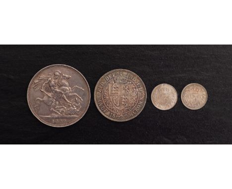 A higher grade 1890 crown, 1895 halfcrown and two 18988 silver 3d coins