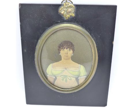 A Regency miniature watercolour portrait of a lady in an ebonised frame 