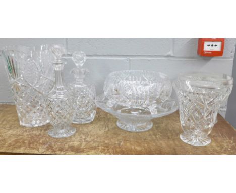 A collection of crystal and glass including a tall vase, heavy glass fruit bowl, etc. 