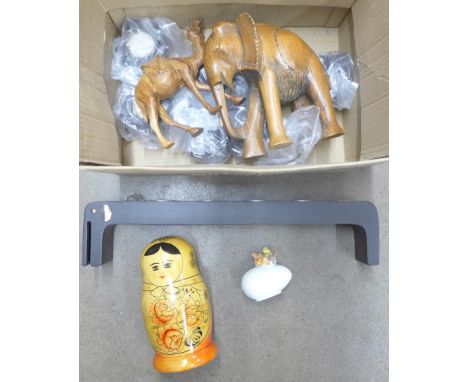 A Russian doll, a carved elephant, camel, Victorian 'egg' with chicken, a/f, and a tea light stand **PLEASE NOTE THIS LOT IS 