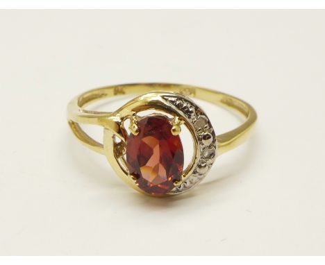 A 9ct gold, red stone and diamond ring, 1.2g, O 