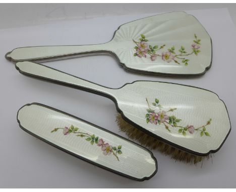 A three piece silver and enamel brush set, Mappin &amp; Webb 