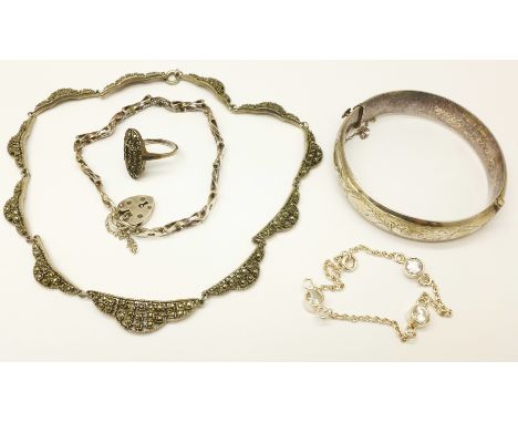 A silver bangle, two silver bracelets, a necklet and a ring 