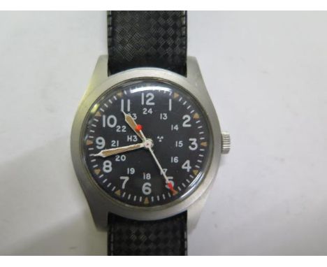 A Hamilton General Purpose Military manual wind wristwatch Mil-W-46374B Nov 1977 - black dial - 33mm case - running, hands ad