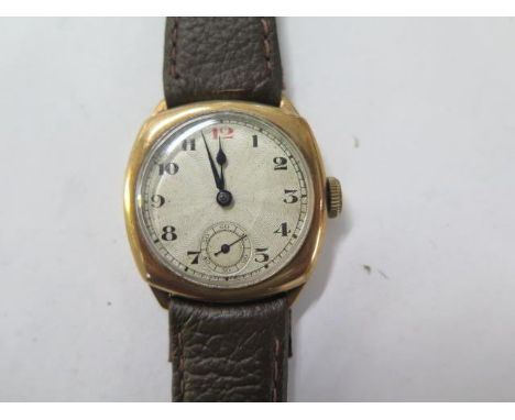 A 9ct yellow gold gents manual wind gents wristwatch with 29mm case on a leather strap - running, hands adjust - total weight