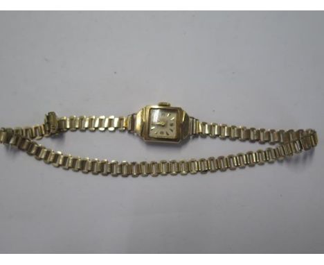 A 9ct yellow gold manual wind ladies watch on a rolled gold strap - running - total weight approx 15 grams 