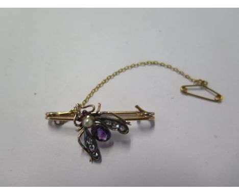 A yellow gold diamond, amethyst, ruby and pearl insect brooch - Length 3cm - surface tests to approx 9ct - approx weight 3 gr