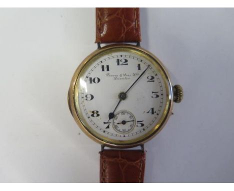 A 9ct gold manual wind wristwatch the dial signed Pearce and Sons Leicester - 32mm case - running, hands advance - approx wei