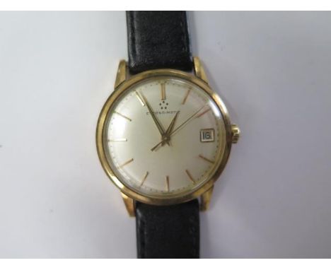 A 9ct yellow gold Eterna-Matic date wristwatch - 33mm case - approx weight 37 grams - running, hands and date adjust 
