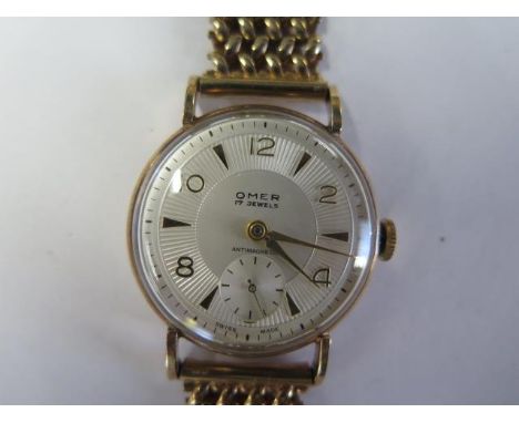 An OMER 9ct yellow gold manual wind wristwatch with 30mm case - total weight approx 37 grams - running, hands adjust 