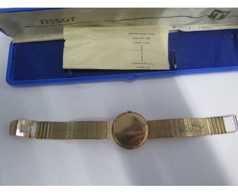 A 9ct yellow gold Tissot manual wind bracelet wristwatch with a 32mm case - Length 20.5cm - total weight approx 54.7 grams - 