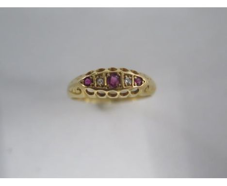 An 18ct yellow gold diamond and ruby ring size L/M - approx weight 2.3 grams 