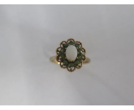 A 9ct yellow gold opal cluster ring size N/O - approx weight 2.8 grams - good condition 