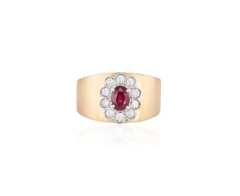 A RUBY AND DIAMOND RINGThe oval-shaped ruby within a surround of round brilliant-cut diamonds to a plain thick hoop, mounted 