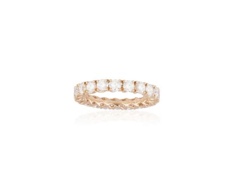 A DIAMOND ETERNITY RINGThe continuous row of round brilliant-cut diamonds, each within a four-claw setting, mounted in 18K ro