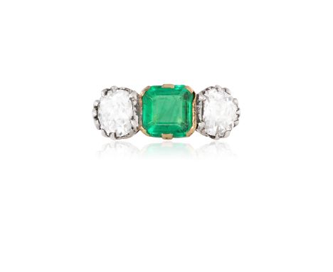 A THREE-STONE EMERALD AND DIAMOND RINGThe central square-cut emerald between old brilliant-cut diamond shoulders, mounted in 