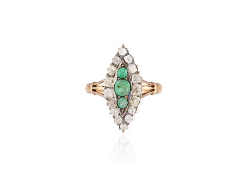 AN EMERALD AND DIAMOND DRESS RINGOf marquise shape panel, set to the centre with three oval-shaped emeralds within a border o