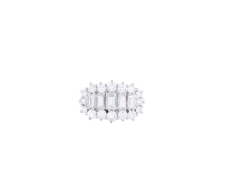 A DIAMOND RINGThe single row of graduated baguette-cut diamonds to the front, within a surround of graduated round brilliant-