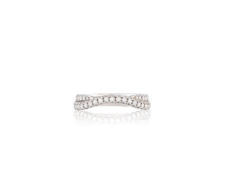 A DIAMOND TWIST HALF ETERNITY RINGThe continuous line of round brilliant-cut diamonds twisting in a wave pattern, with a seco