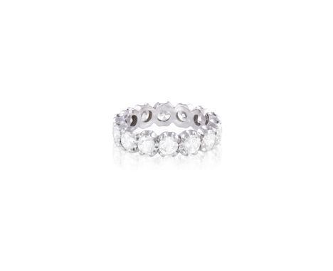 A DIAMOND ETERNITY RING The continuous row of round brilliant-cut diamond, mounted in 18K gold, diamonds approximately 2.80ct