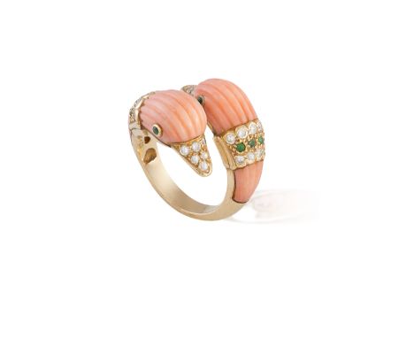 A CORAL, DIAMOND AND EMERALD RING, BY VAN CLEEF &amp; ARPELS, CIRCA 1965Designed as two opposing carved corallium rubrum duck