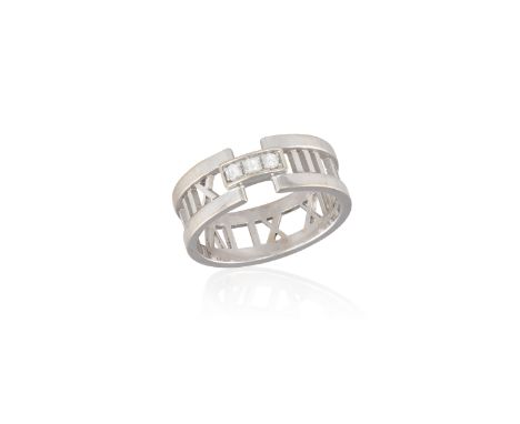 A GENTLEMAN'S DIAMOND 'ATLAS' RING, BY TIFFANY &amp; CO.The openwork ring with a continuous series of Roman numerals, the fro
