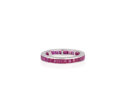 A RUBY ETERNITY RINGThe square-cut rubies within channel setting throughout, mounted in 14K gold, ring size P 