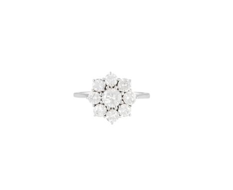 A DIAMOND CLUSTER RINGThe central round brilliant-cut diamond within a surround of similarly-cut diamonds, mounted in gold, d