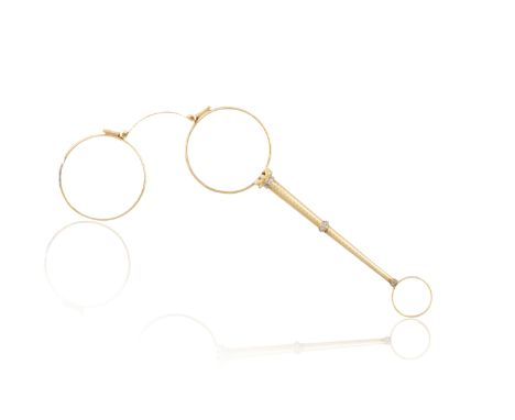 AN EARLY 20TH CENTURY GOLD AND DIAMOND LORGNETTE, FRENCHThe gold guillauché stem with millegrain-set rose-cut diamond termina