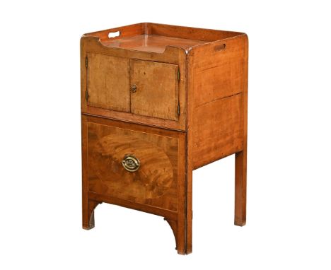 A Georgian mahogany inlaid commode/bedside cabinet, with three quarter galleried top above a pair of inlaid doors with brass 