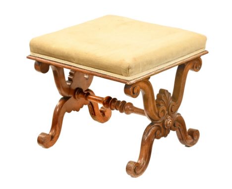 A late Victorian walnut stool, with upholstered top raised on scroll supports with centre stretcher. Height 45 cm, top 51 cm 