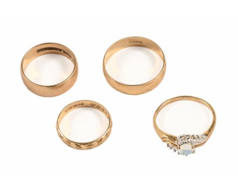 Three 9 ct gold wedding bands and a dress ring containing clear coloured stones and synthetic opal.&nbsp; Gross weight 8 gram
