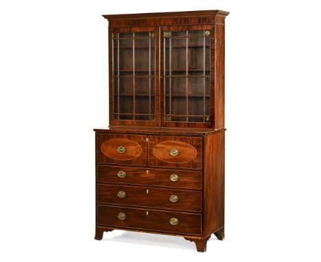 A Georgian mahogany secretaire bookcase, with dentil cornice above a pair of glazed doors with three internal shelves, the se