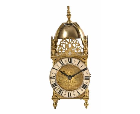 A brass lantern clock, with silvered dial by Daniel Webber, with key. Height 24 cm (see illustration).