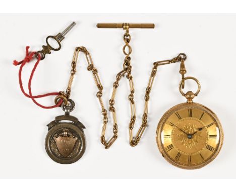 An 18 ct gold pocket watch, London hallmark 1928 with plated watch chain and T bar and silver fob. Watch weight +/- 63 grams.