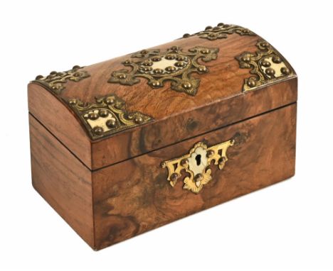 A Victorian walnut brass mounted and ivorine dome topped tea caddy. Height 12 cm, width 20 cm (see illustration).