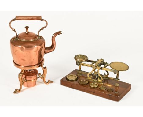 A set of brass postal scales, with a part set of weights together with a miniature copper spirit kettle with stand.