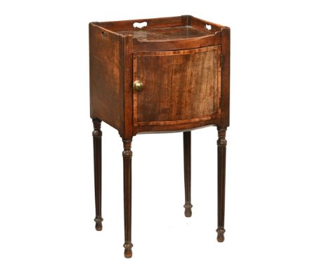 A Georgian inlaid mahogany bowfronted pot cupboard, with three quarter galleried top and single door raised on reeded legs. H