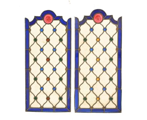 Two 19th century shaped rectangular stained glass panels, with lead astragals.  Each height 90 cm, width 42 cm.